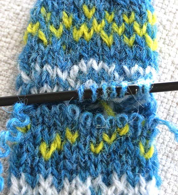 image of blue and yellow knitting with pick up stitches demo