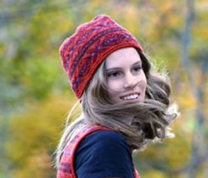 young woman wearing an orange fair isle cap