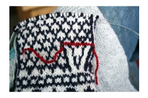 Black and White Knit Mittens with red thread
