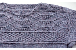 yoke of a guernsey sweater in purple heather