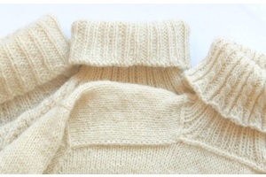 image of three knitted turtlenecks in cream, ribs and cable