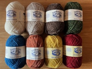 image of eight different colors of balls of Shetland Spindrift wool with labels