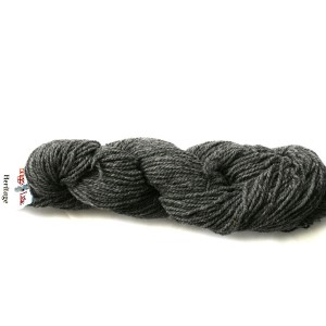 full skein of dark gray Heritage wool with tag saying Briggs and Little Heritage