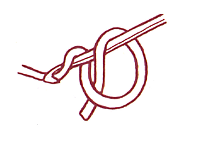 Close up of a drawing in red of cast on loop for circular shawls