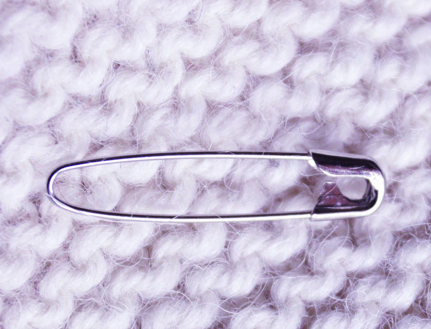 Close up of a coilless pin used for marking stitches