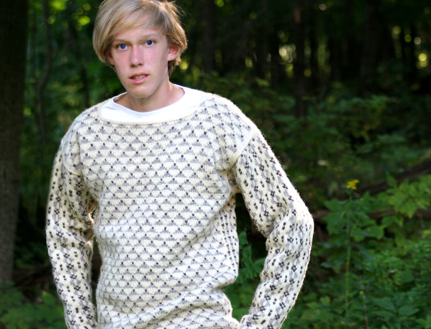 Eli Swansen, young blonde man, wearing the Faroe pattern sweater, black and cream wool