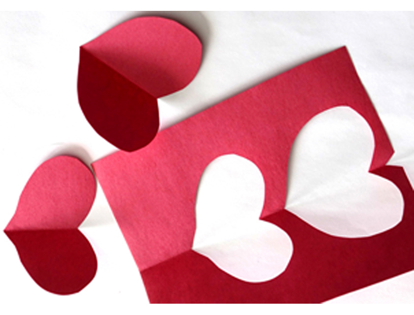 red construction paper hearts cut out and individual