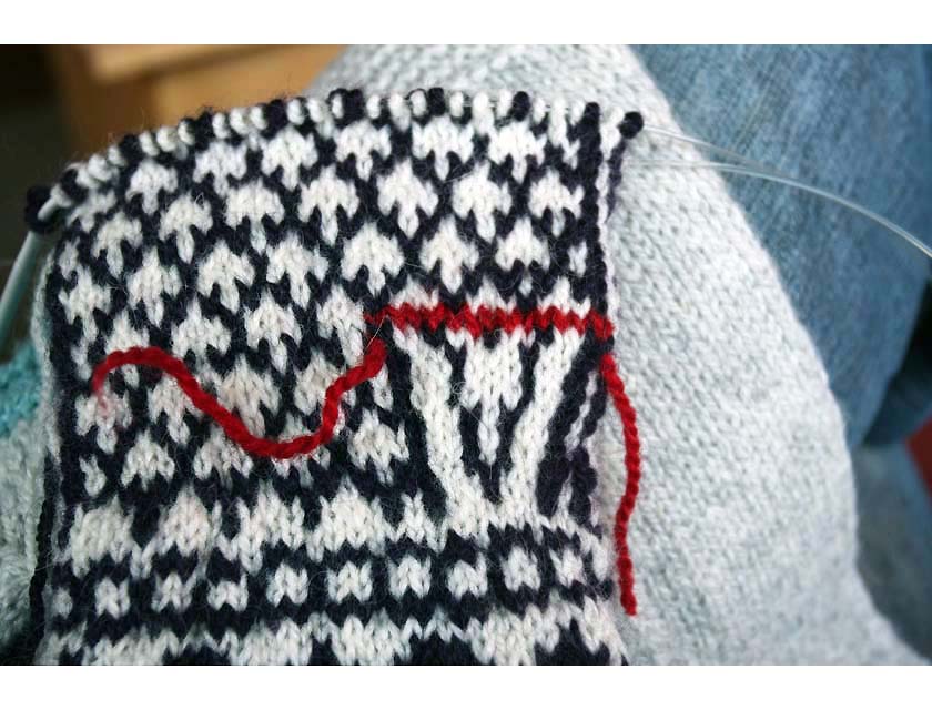 Black and White Knit Mittens with red thread