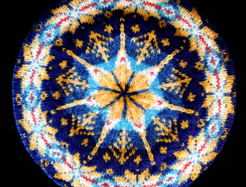 close up of Mary Rowe's Starry Night tam in blues and yellow