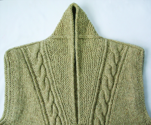 close up of shawl collared vest closed