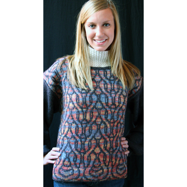 woman wearing cowl with knit and purl stitch sweater knit in blues and purples