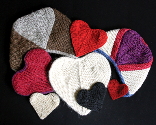 group of knitted heart garments