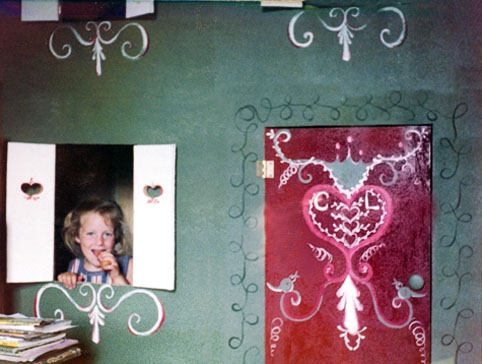 playhouse red and green with girl in window