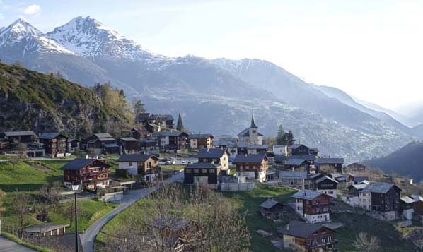 A village in Italy with steepled houses and mountains